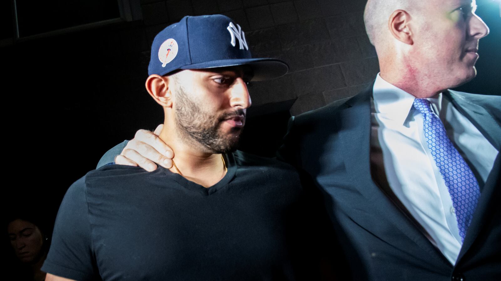 Nauman Hussain (L), the operator of a limousine company that owned the vehicle involved in a crash that killed 20 people in upstate New York, leaves with his lawyer Lee Kindlon (R) after posting bond at Cobleskill Town Court in Cobleskill, New York.