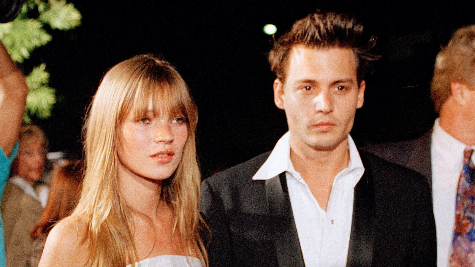 articles/2013/10/14/kate-moss-and-johnny-depp-reunite-for-a-music-video-fashion-photographer-mario-testino-receives-honorary-obe-from-the-queen/131014-moss-depp-reunite-cheat_weydzd