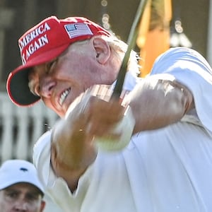 Donald Trump tees off during a visit a day ahead of the 2022 LIV Golf Invitational Miami at Trump National Doral Miami golf club on October 27, 2022 in Miami, Florida.