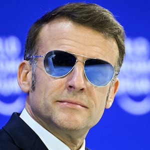 TOPSHOT - France's President Emmanuel Macron looks on during the World Economic Forum (WEF) annual meeting in Davos on January 20, 2026. The World Economic Forum takes place in Davos from January 19 to January 23, 2026. (Photo by Fabrice COFFRINI / AFP via Getty Images)