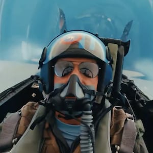 Pete Hegseth flying in the back of a fighter jet.