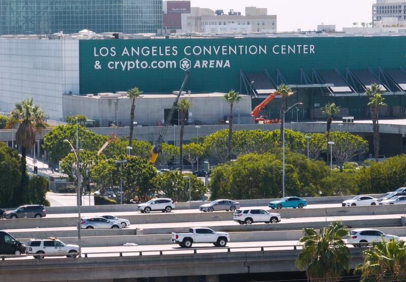 LOS ANGELES, CA - SEPTEMBER 03: Traffic on the 110 freeway flows past the Los Angeles Convention Center. The city of Los Angeles has yet to approve an expansion project that would connect the West and South Halls with a three-story building between them and built over Pico Boulevard. Photographed in Los Angeles, CA on Wednesday, Sept. 3, 2025. If approved, it will be completed for the 2028 Olympics. (Myung J. Chun / Los Angeles Times via Getty Images)