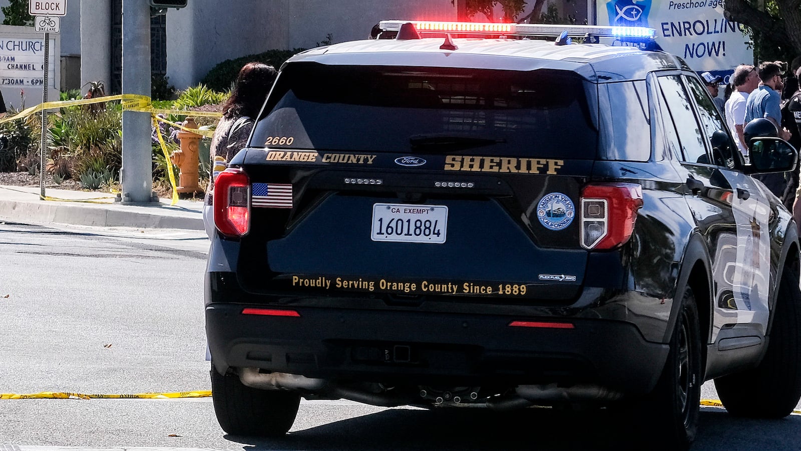 Police vehicles are seen after a shooting inside Geneva Presbyterian Church in Laguna Woods, California.