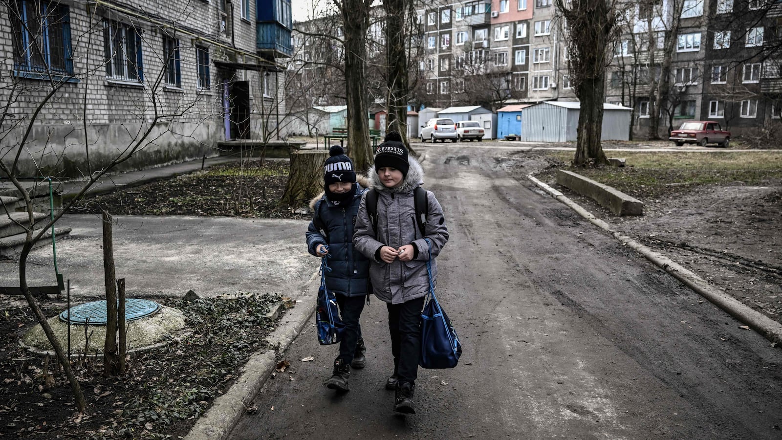 young kids walking in the street