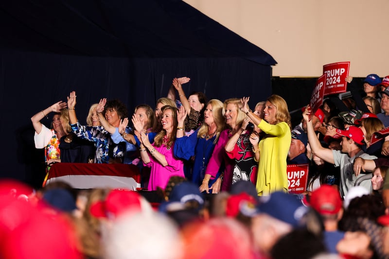 Women wave as  Donald Trump holds a campaign rally in Erie, Pennsylvania, U.S., July 29, 2023.