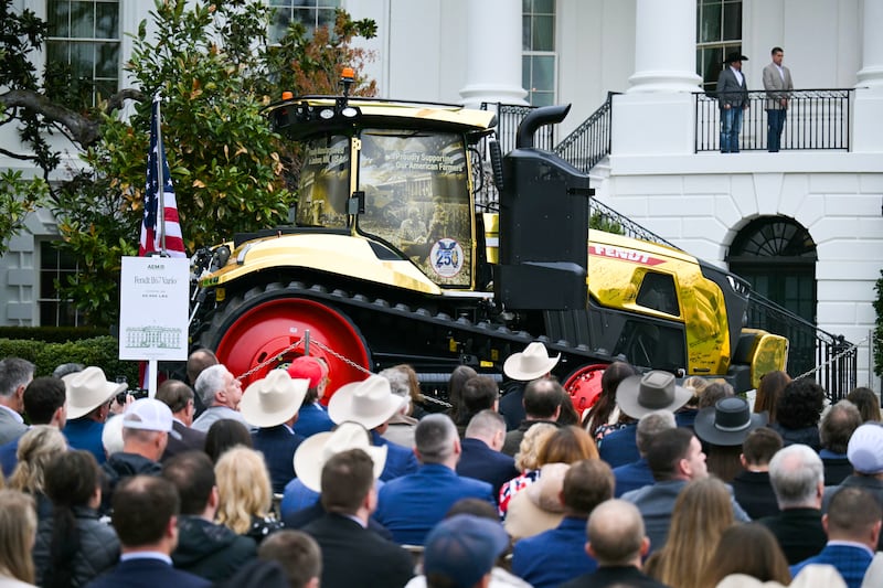 Attendees listen to President Donald Trump deliver remarks to farmers from the Truman balcony of the White House in Washington, DC, on March 27, 2026.