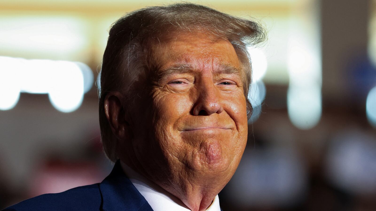 Donald Trump reacts as he holds a campaign rally in Erie, Pennsylvania, U.S., July 29, 2023.