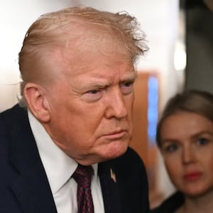 US President Donald Trump speaks to the press aboard Air Force One on January 11, 2026. Trump said Sunday his administration was working well with Venezuela's interim leader Delcy Rodriguez and that he would be open to meeting with her. (Photo by ANDREW CABALLERO-REYNOLDS / AFP via Getty Images)