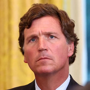 Tucker Carlson looks on during U.S. President Donald Trump's meeting with an oil industry executives, at the White House in Washington, D.C., U.S., January 9, 2026. REUTERS/Kevin Lamarque