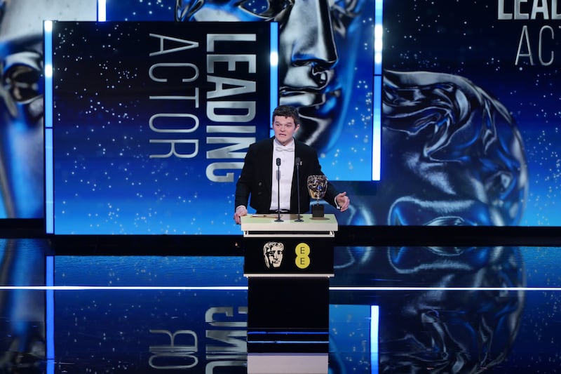Robert Aramayo accepts the Leading Actor Award for 'I Swear' on stage during the EE BAFTA Film Awards 2026 at The Royal Festival Hall on February 22, 2026 in London, England.
