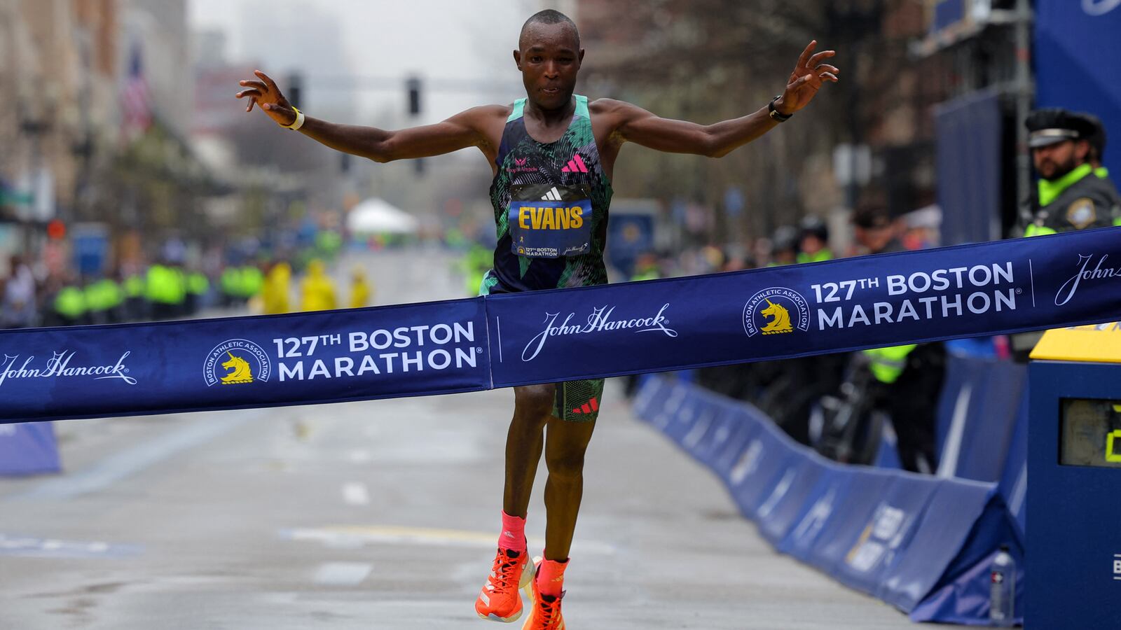 Kenya’s Evans Chebet crosses the finish line to win the 2023 Boston Marathon.