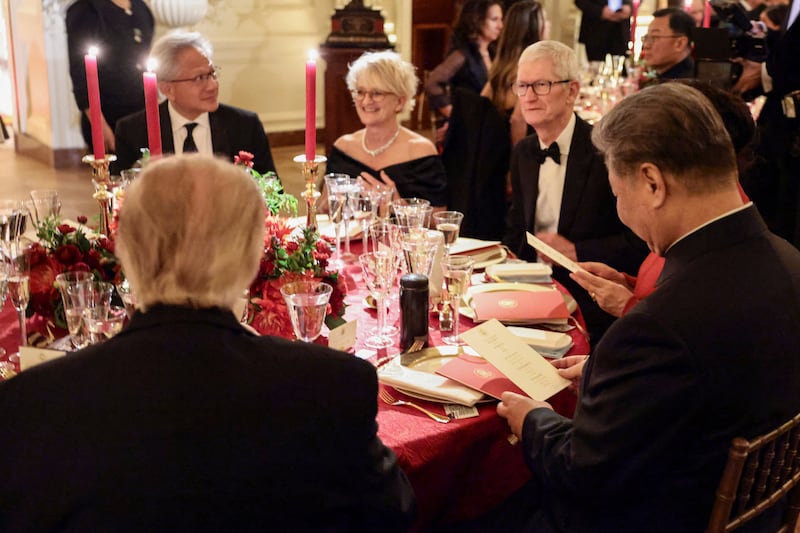 US President Donald Trump and Chinese President Xi Jinping sit together during a state dinner at the White House in Washington, D.C., US, September 24, 2026. REUTERS/Evelyn Hockstein