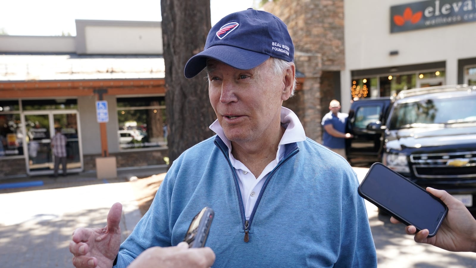 A picture of U.S. President Joe Biden speaking to reporters. What did Joe Biden think of Donald Trump’s Georgia mugshot? “Handsome guy,” Biden told reporters on Friday, while evidently smirking.