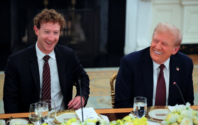 U.S. President Donald Trump and Meta CEO Mark Zuckerberg smile during a private dinner for technology and business leaders in the State Dining Room at the White House in Washington, D.C., U.S., September 4, 2025.  REUTERS/Brian Snyder
