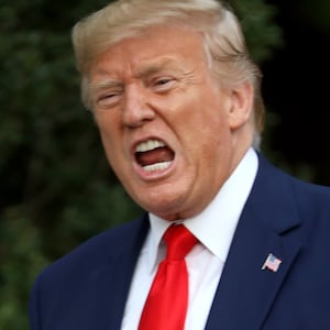 WASHINGTON, DC - OCTOBER 03: U.S. President Donald Trump shouts at members of the media as he returns to the White House on October 03, 2019 in Washington, DC. Trump traveled to Florida earlier in the day. (Photo by Win McNamee/Getty Images)