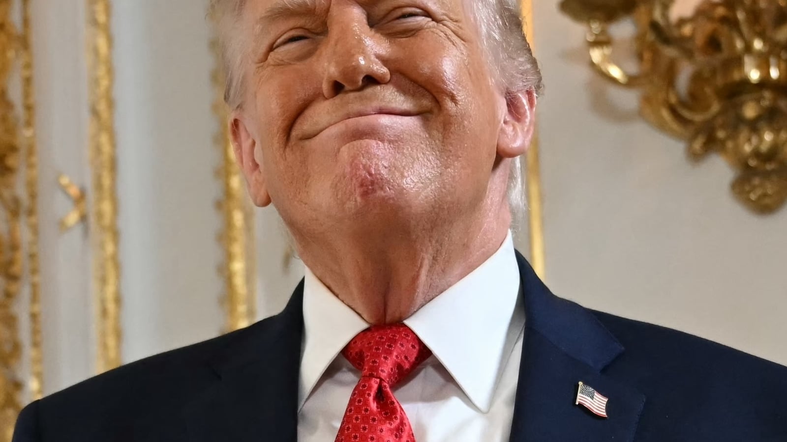 US President Donald Trump reacts as he arrives at a dedication ceremony for Southern Boulevard, in the ballroom at Mar-a-Lago in Palm Beach, Florida, on January 16, 2026. Palm Beach Southern Boulevard, between Kirk Road and South Ocean Boulevard, is being renamed as "President Donald J. Trump Boulevard." (Photo by ANDREW CABALLERO-REYNOLDS / AFP)