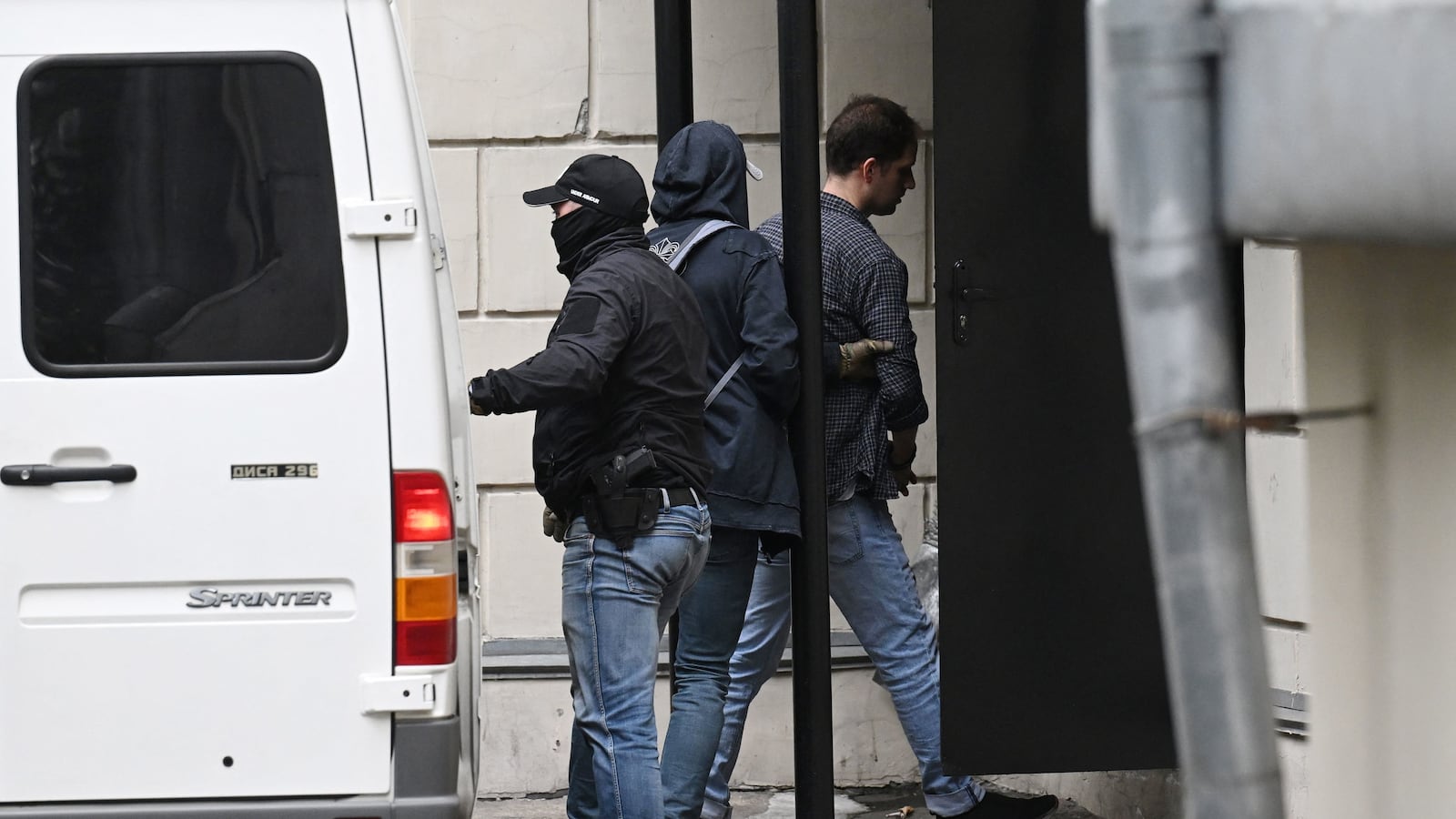 Evan Gershkovich is escorted outside a Moscow court on August 24, 2023.