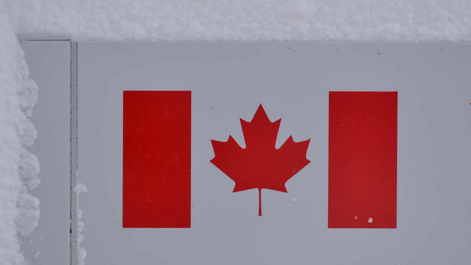 A sign with the Canadian national flag.