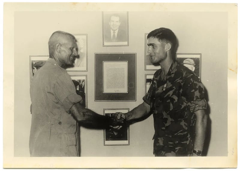 Robert Mueller received an award from his regimental commander, Col. Martin “Stormy” Sexton, in Vietnam in 1969.
