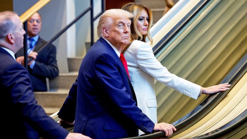 President Donald Trump and first lady Melania Trump ride an escalator as they arrive to attend the 80th United Nations General Assembly, in New York City, New York, on Sept. 23, 2025.