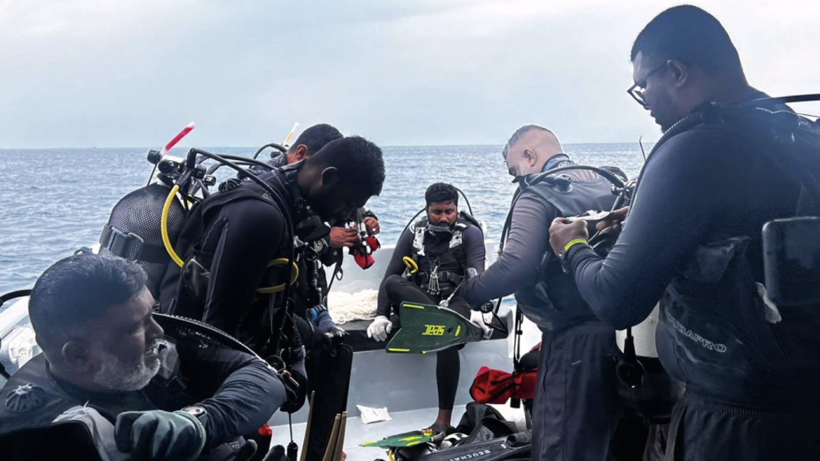 Divers preparing to search for the bodies of missing Italian divers in the Maldives