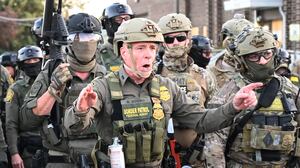 Border Patrol Chief Gregory Bovino of the El Centro Sector stands amid a protest outside an ICE facility in Broadview