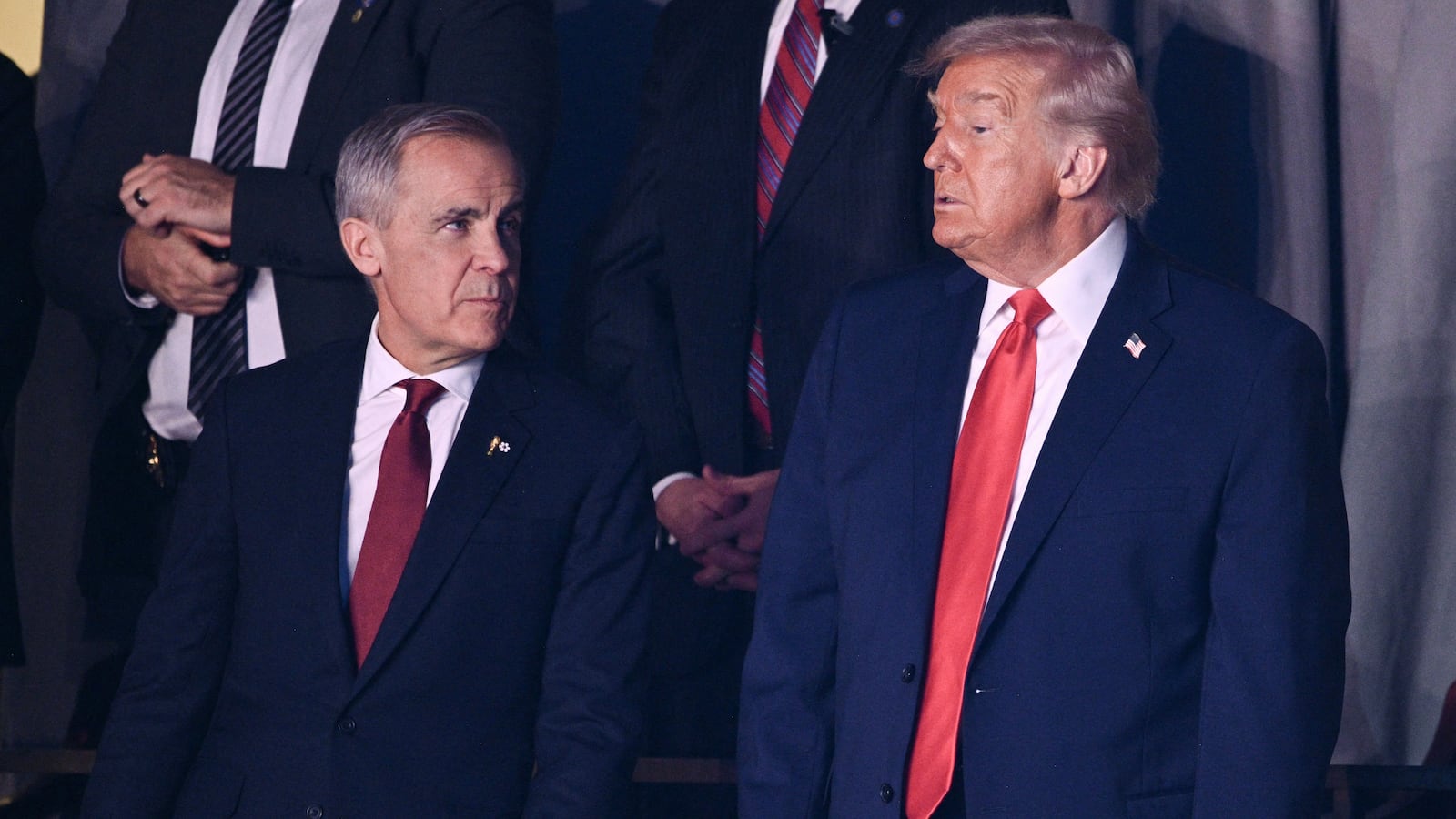 (L-R) Canada's Prime Minister Mark Carney and US President Donald Trump attend the draw for the 2026 FIFA Football World Cup taking place in the US, Canada and Mexico, at the Kennedy Center, in Washington, DC, on December 5, 2025. (Photo by Brendan SMIALOWSKI / AFP via Getty Images)