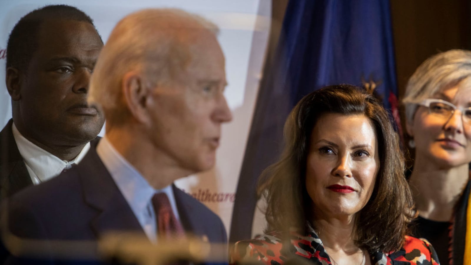 Joe Biden speaks as Michigan Governor Gretchen Whitmer looks on at an event in Grand Rapids, Michigan.