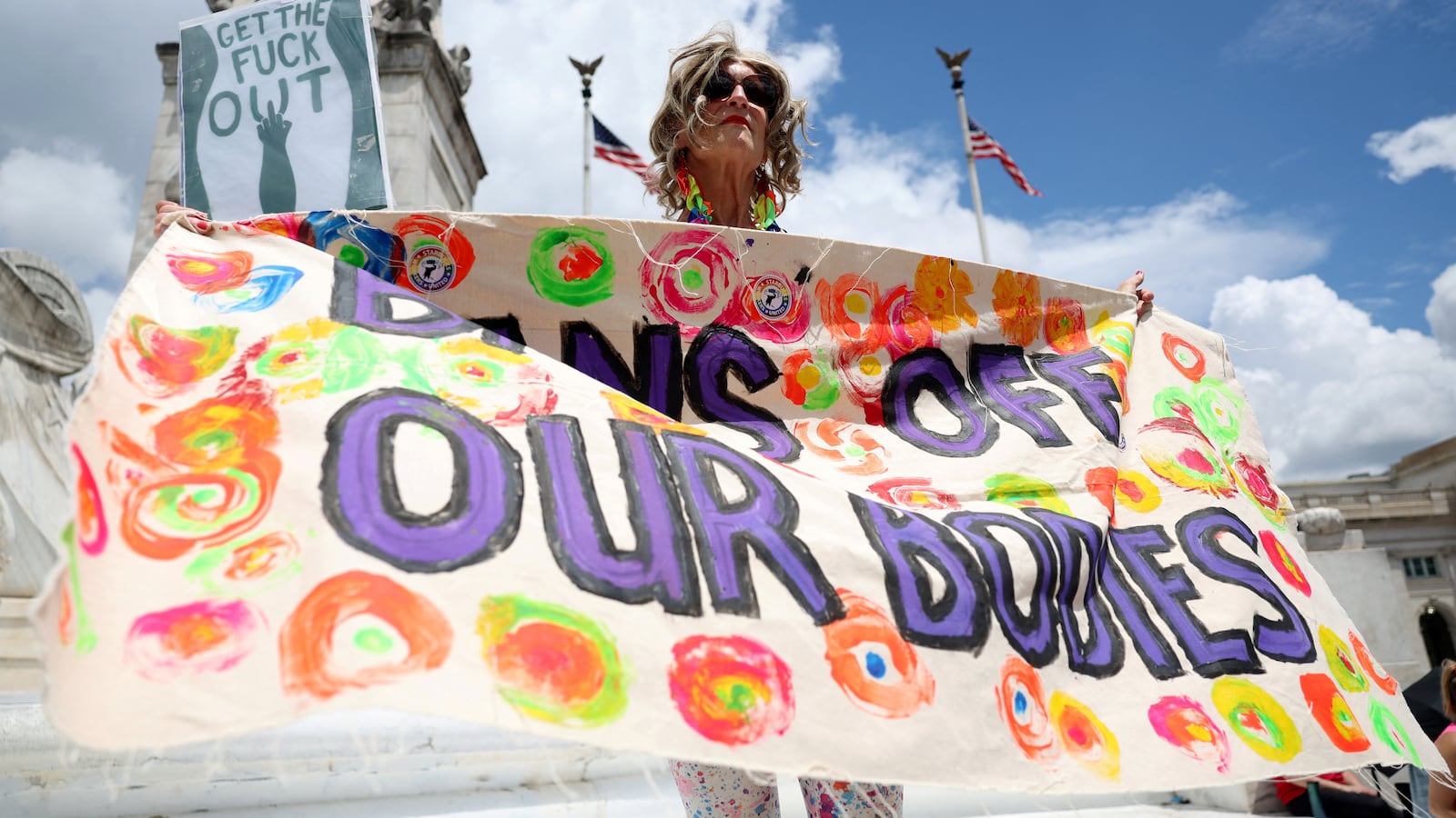 An abortion rights demonstrator attends the rally to mark the first anniversary of the U.S. Supreme Court ruling in the Dobbs v Women's Health Organization case.
