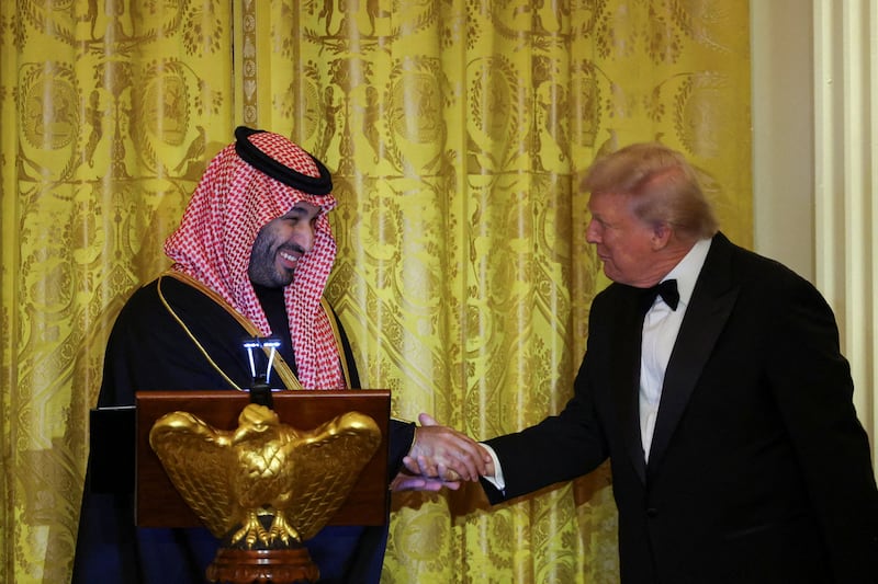 U.S. President Donald Trump greets Saudi Crown Prince and Prime Minister Mohammed bin Salman, during a dinner at the White House in Washington, D.C., U.S., November 18, 2025.