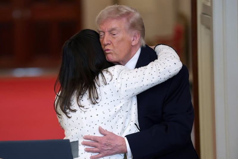 WASHINGTON, DC - FEBRUARY 23:  The mother of Laken Riley, Allyson Phillips is embraced by U.S. President Donald Trump during an Angel Families remembrance ceremony held in the East Room at the White House February 23, 2026 in Washington, DC. The term “Angel Families” is used to describe people who have lost a relative to a crime committed by an undocumented immigrant. (Photo by Win McNamee/Getty Images)