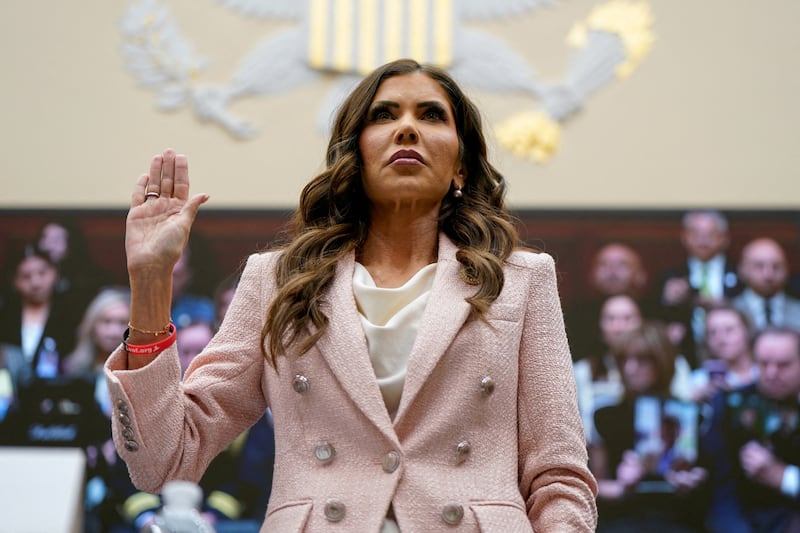 U.S. Homeland Security Secretary Kristi Noem wears a wristband in support of the non-profit organization 'Lost Voices of Fentanyl', as she is sworn in on the day she testifies before a House Judiciary Committee hearing on "Oversight of the Department of Homeland Security," on Capitol Hill in Washington, D.C., U.S., March 4, 2026.