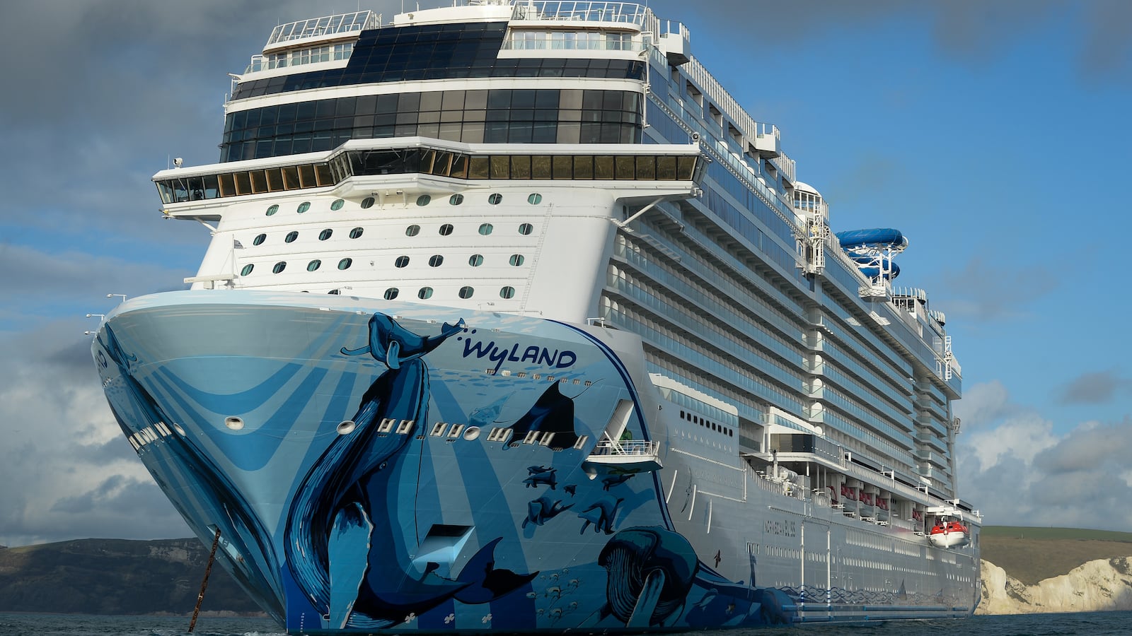 Cruise ship Norwegian Bliss anchored in the English Channel off the Dorset coast.