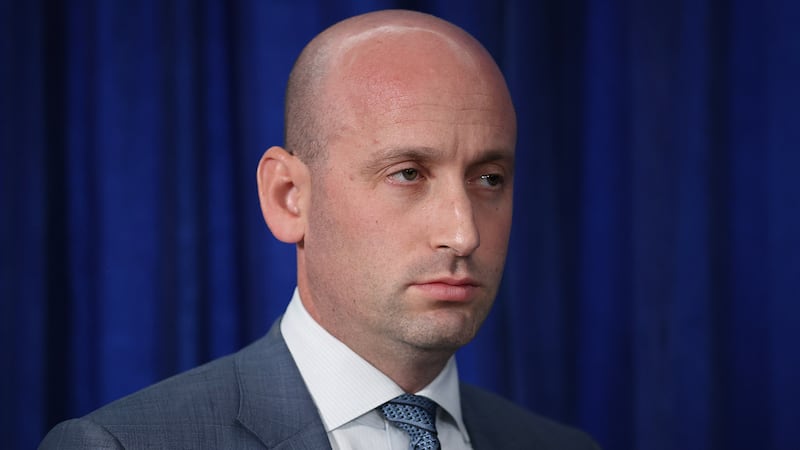 White House Deputy Chief of Staff and Homeland Security Advisor Stephen Miller listens as U.S. President Donald Trump addresses the media during a news conference at his Mar-a-Lago club on January 03, 2026, in Palm Beach, Florida.
