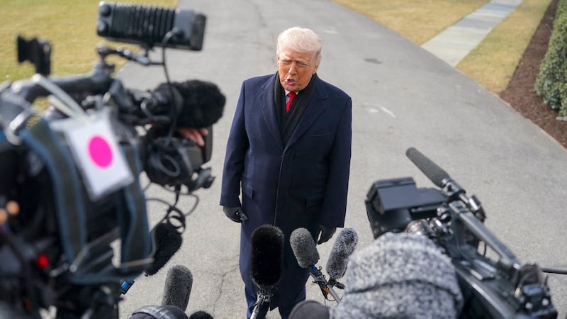 U.S. President Donald Trump speaks to the press, befrore departing for Florida from the South Lawn, at the White House in Washington, D.C., U.S., January 16, 2026.