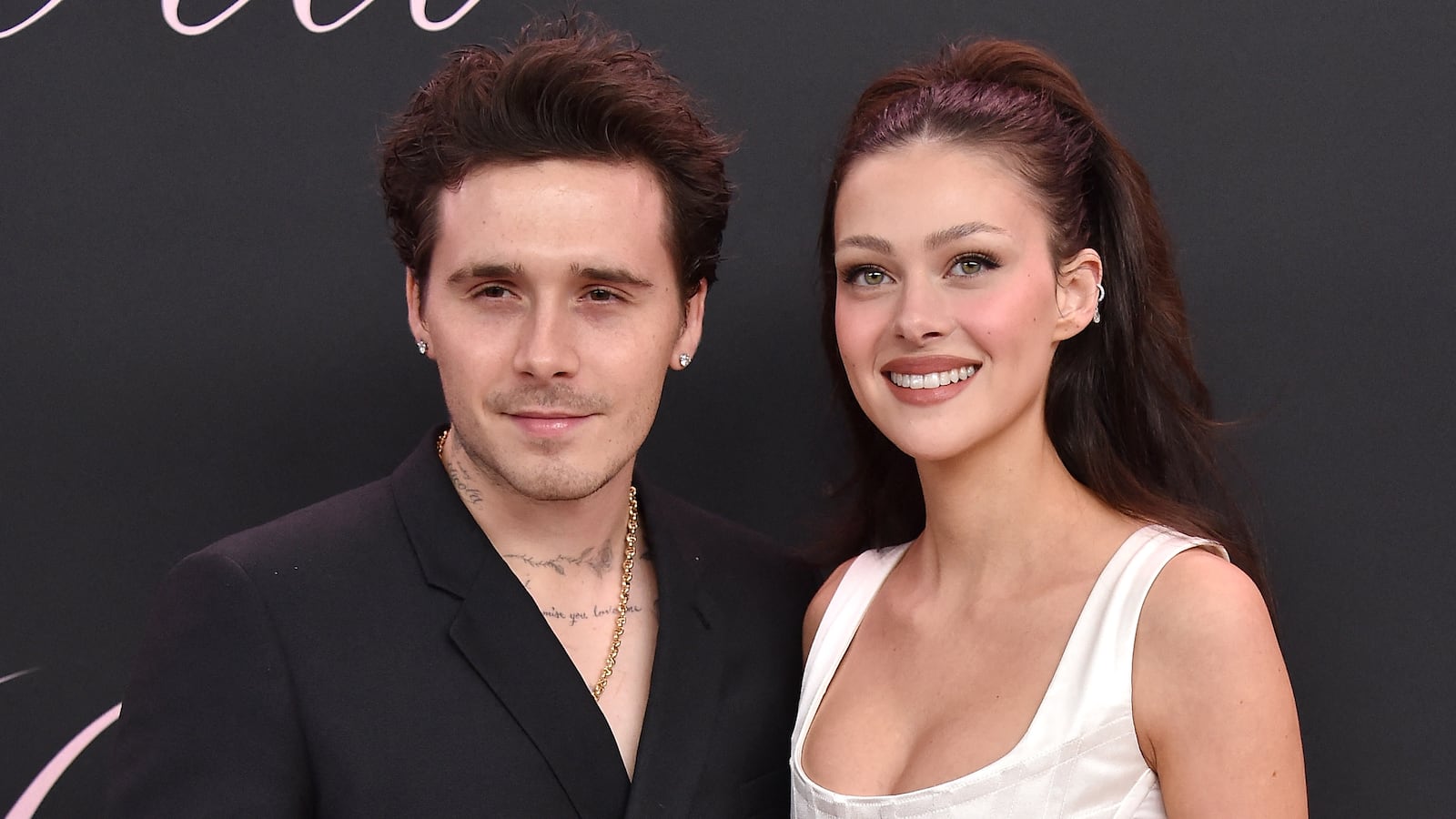 Former British model Brooklyn Beckham (L) and wife US actress Nicola Peltz Beckham arrive for the premiere of the movie "Lola" at the Bruin Theatre, in Los Angeles, California on February 3, 2024. (Photo by LISA O'CONNOR / AFP) (Photo by LISA O'CONNOR/AFP via Getty Images)