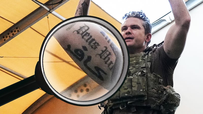 Pete Hegseth doing pull-ups, showing off his tattoos.