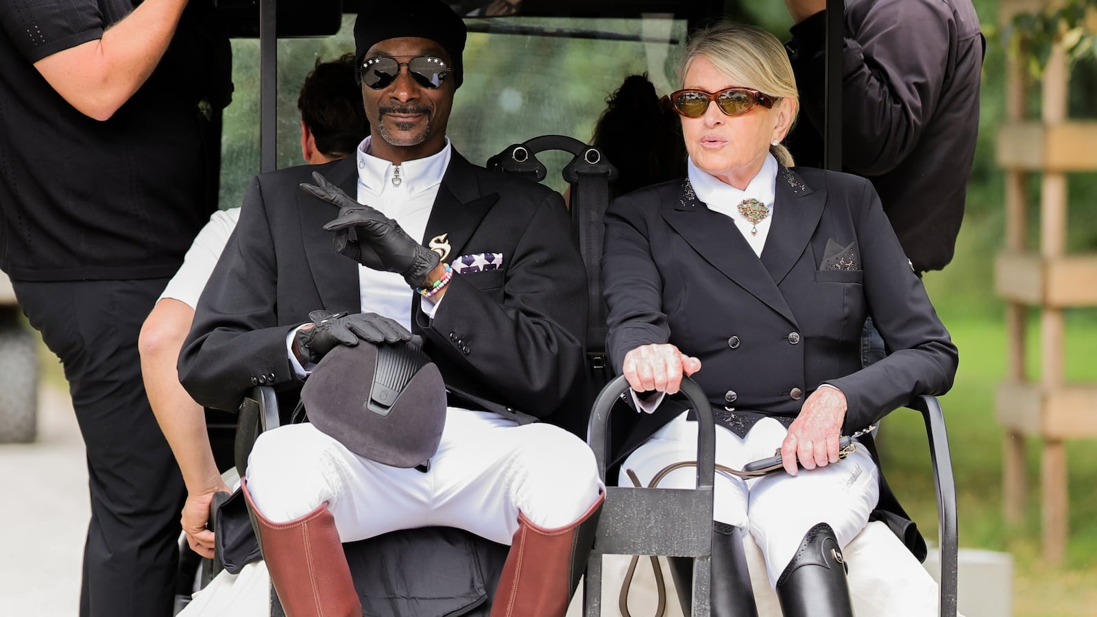 03 August 2024, France, Versailles: Olympics, Paris 2024, equestrian sport, dressage, team, final, US rapper Snoop Dogg and Martha Stewart ride a golf cart. Photo: Rolf Vennenbernd/dpa (Photo by Rolf Vennenbernd/picture alliance via Getty Images)