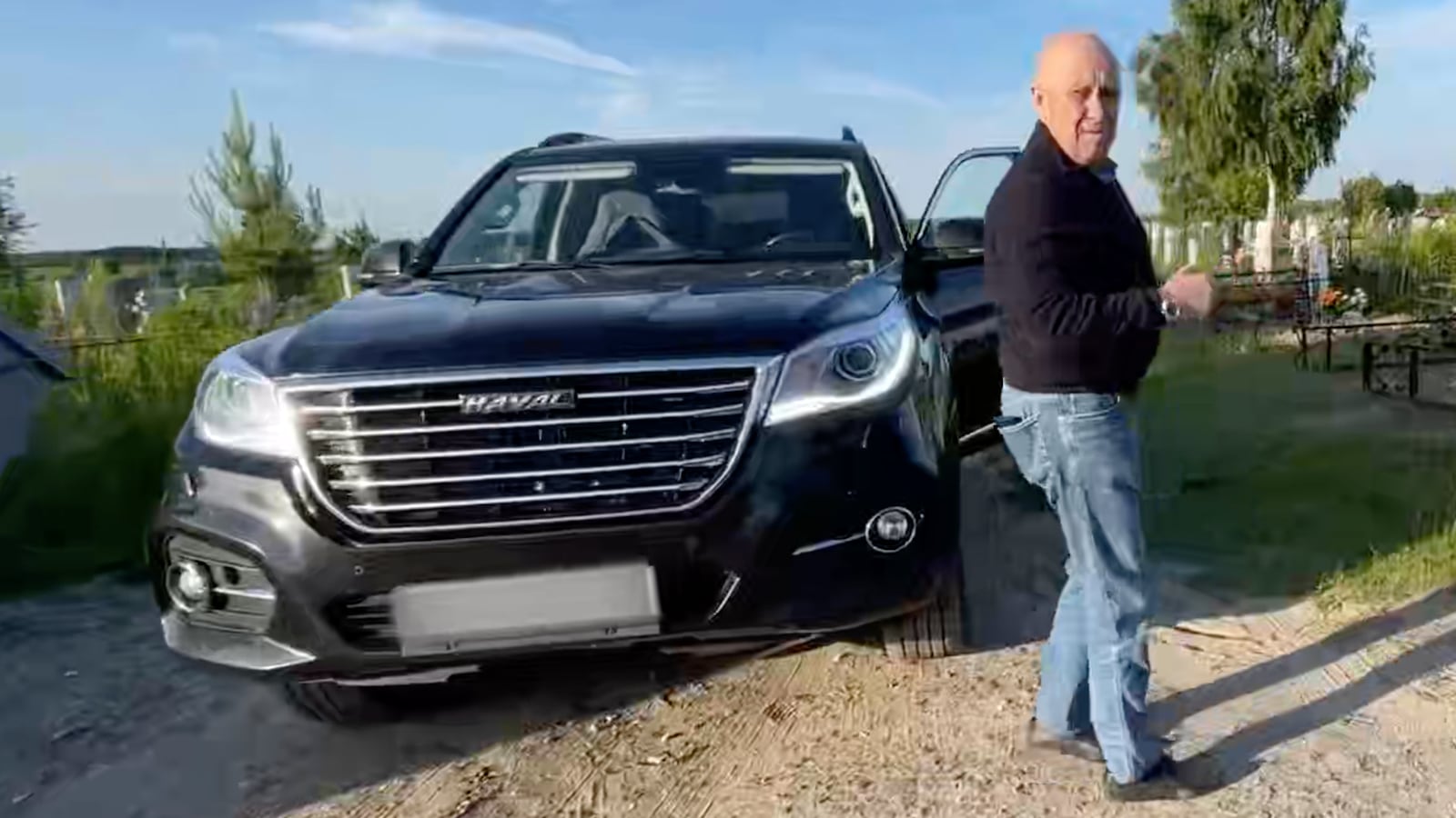 Prigozhin with a car gifted to the family of a dead Wagner mercenary.