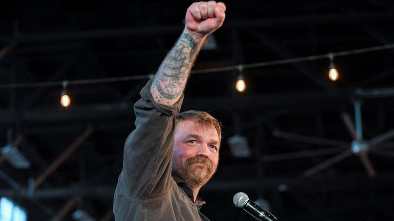 Graham Platner gestures during a "Fighting Oligarchy" campaign rally with U.S. Vermont Senator Bernie Sanders in Maine earlier this week..