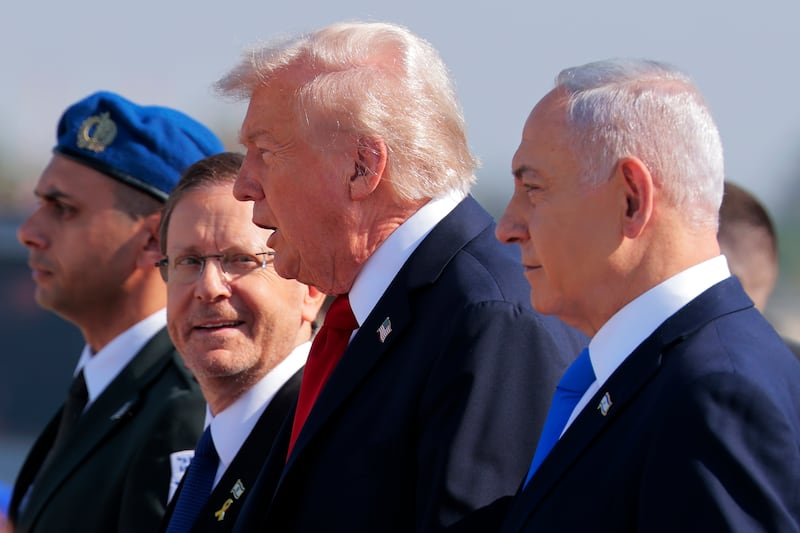 Trump requested a pardon from Herzog  (left) during an October trip to Israel.