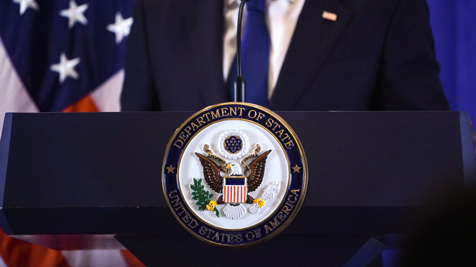 The seal of the U.S. State Department is seen on a lectern