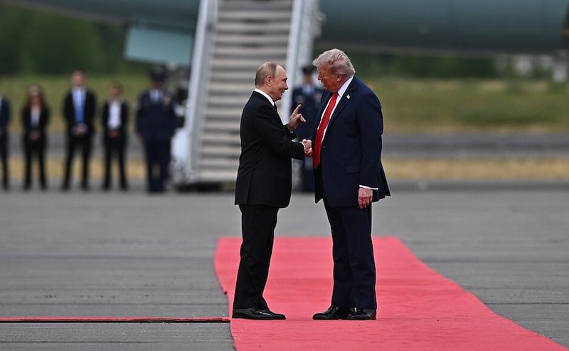 ALASKA, US - AUGUST 15 : (----EDITORIAL USE ONLY - MANDATORY CREDIT - ' KREMLIN PRESS OFFICE / HANDOUT' - NO MARKETING NO ADVERTISING CAMPAIGNS - DISTRIBUTED AS A SERVICE TO CLIENTS----) President Donald Trump meets his Russian counterpart, Vladimir Putin on the tarmac in a red-carpet greeting after the Russian presidential plane touched down in Anchorage, Alaska, United States on August 15, 2025. President Donald Trump and his Russian counterpart, Vladimir Putin, begin critical talks in Alaska Friday, aimed at bringing an end to the Kremlin's over-three-year war on Ukraine. (Photo by Kremlin Press Office / Handout/Anadolu via Getty Images)