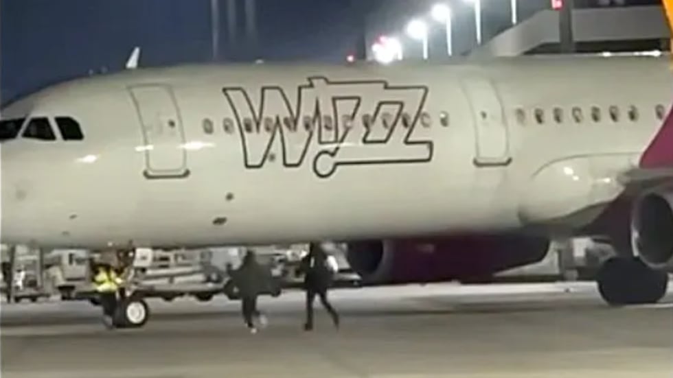 Late passengers attempted to board a flight in Germany as it was trying to take off.