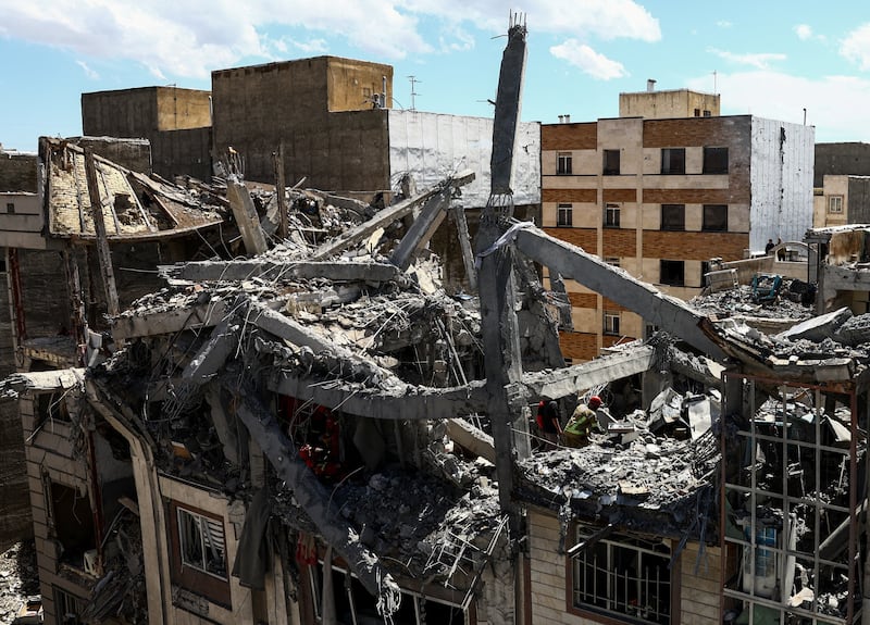 A view of a residential building damaged by a strike, amid the U.S.-Israeli conflict with Iran, in Tehran, Iran, March 27, 2026.