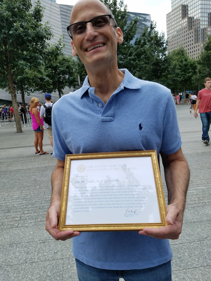 Dr. Michael Guttenberg receiving an award at a 9/11 memorial in 2017, two months before his death.