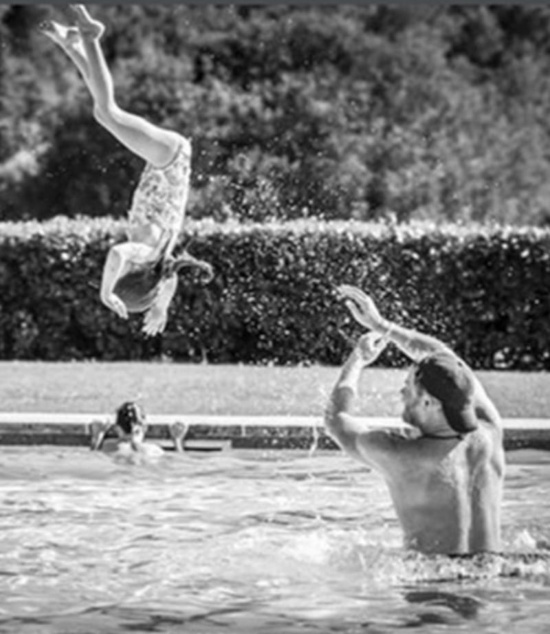 Harry hurls kids in the pool.
