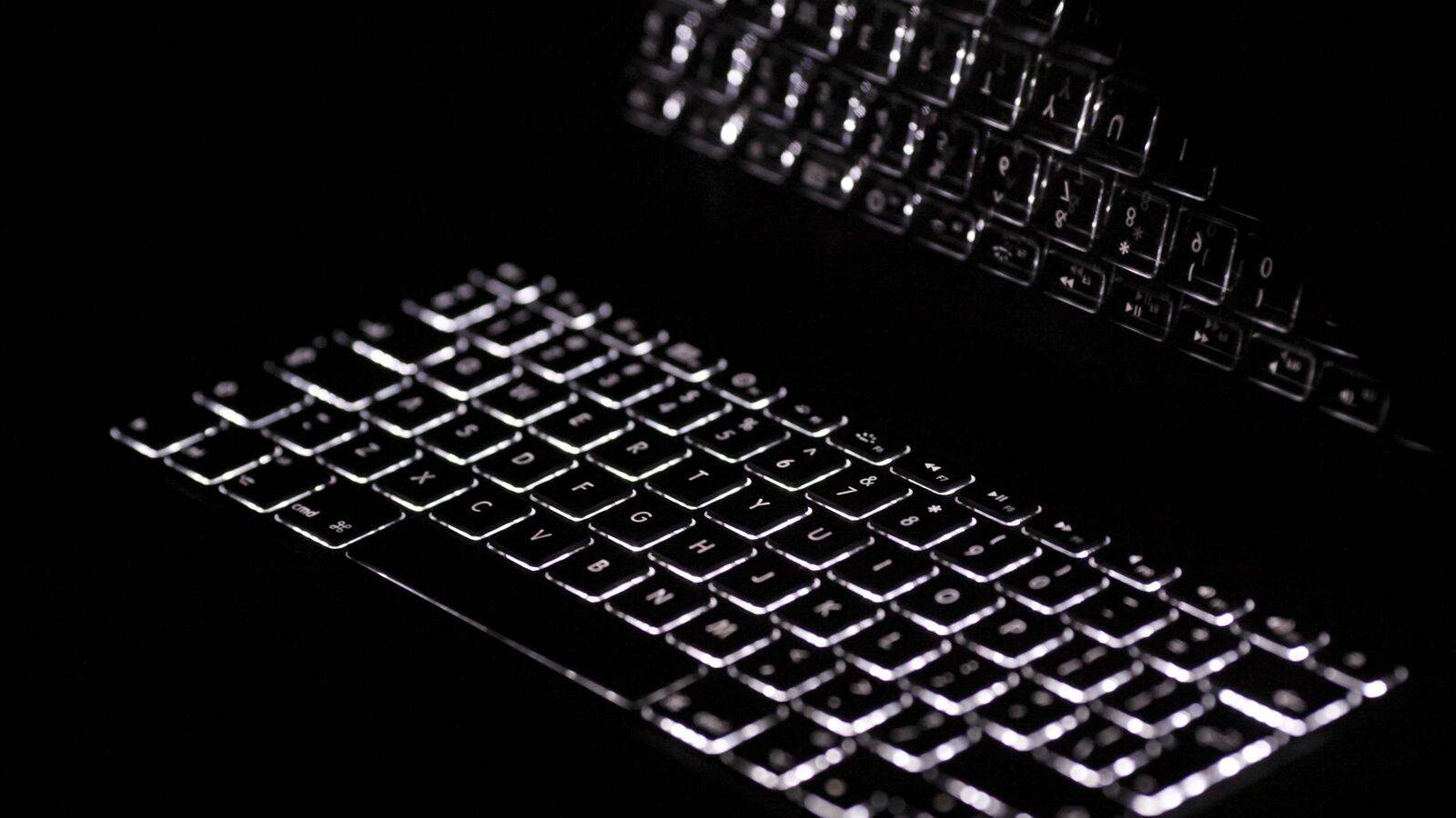A backlit Mac laptop keyboard.