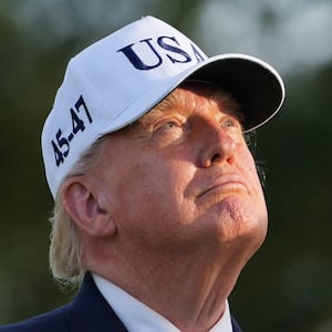 US President Donald Trump looks on as he attends the Presidents Cup golf tournament at Medinah Country Club, in Medinah Illinois, US, September 27, 2026. REUTERS/Nathan Howard