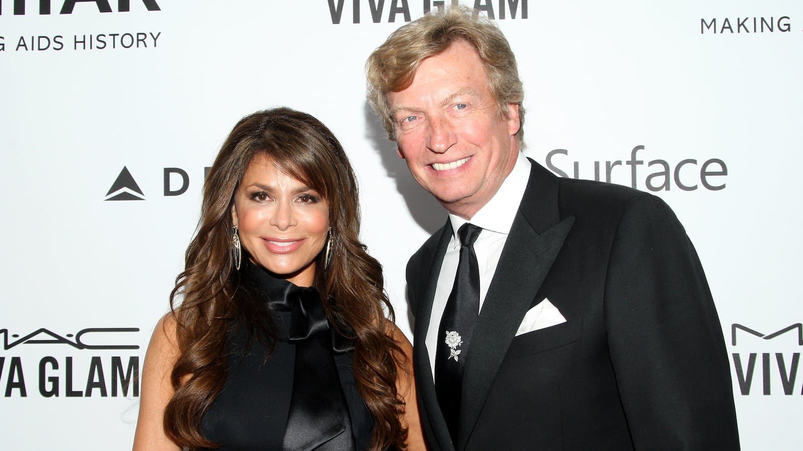 TV personalities Paula Abdul (L) and Nigel Lythgoe attend the 2013 amfAR Inspiration Gala Los Angeles at Milk Studios on December 12, 2013 in Los Angeles, California.